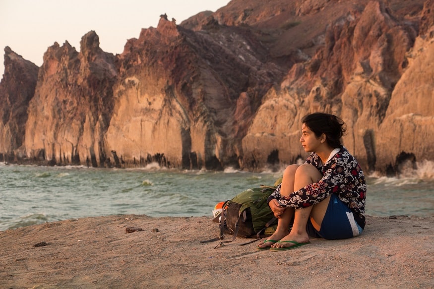 female hostel owners, girl sitting on the beach in Iran