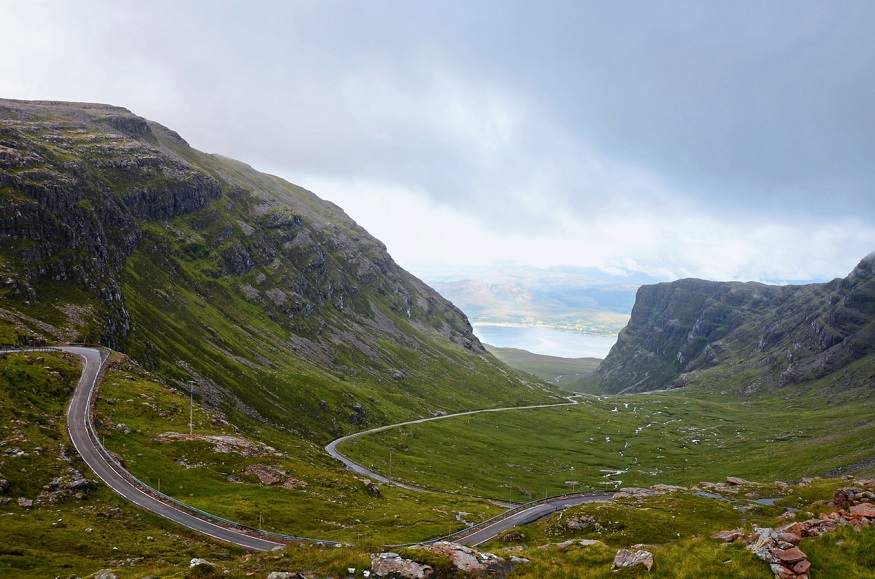 scotland road trip, road through mountains in skye